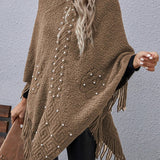 Strikket poncho med perler og frynser – elegant og varm dameponcho