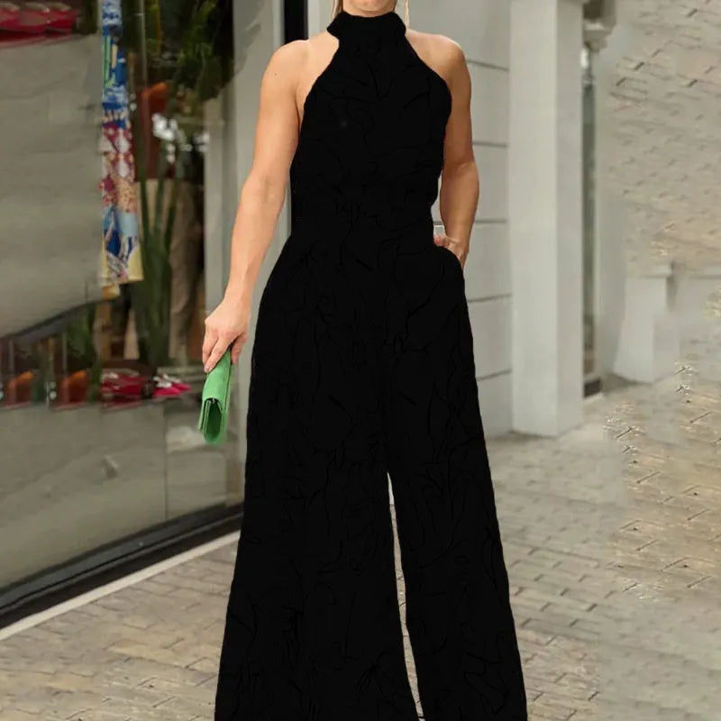 Halterneck jumpsuit med vidde ben og abstrakt print