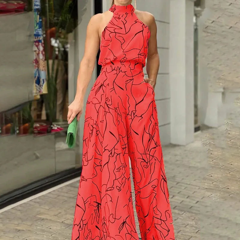 Halterneck jumpsuit med vidde ben og abstrakt print