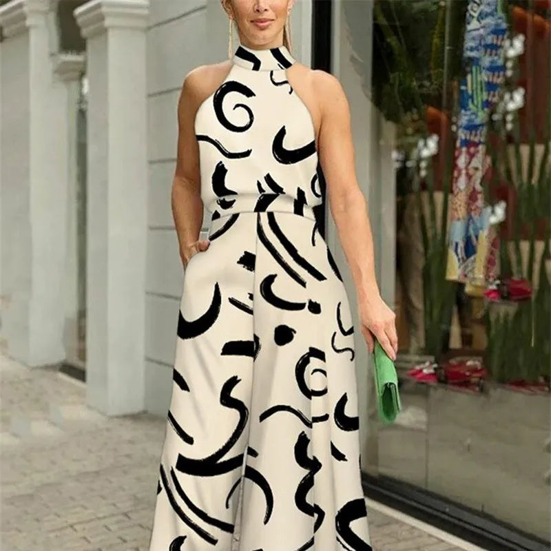 Halterneck jumpsuit med vidde ben og abstrakt print