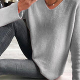 Let striktrøje med v-hals og blød afslappet pasform