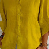 Løs Skjortebluse med Oprullede Ærmer – Let og Elegant Hverdagsstil