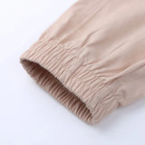 Beige tapered bukser til kvinder – elegant med elastiske ankler