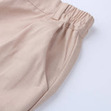 Beige tapered bukser til kvinder – elegant med elastiske ankler