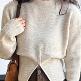 Striktrøje med asymmetrisk lukning og moderne pasform