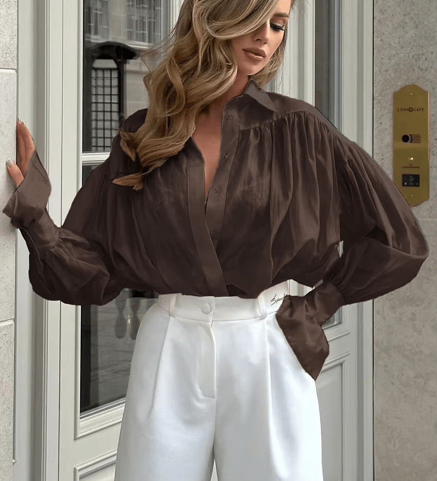 Elegant bluse med bindedetalje og let, luftig pasform