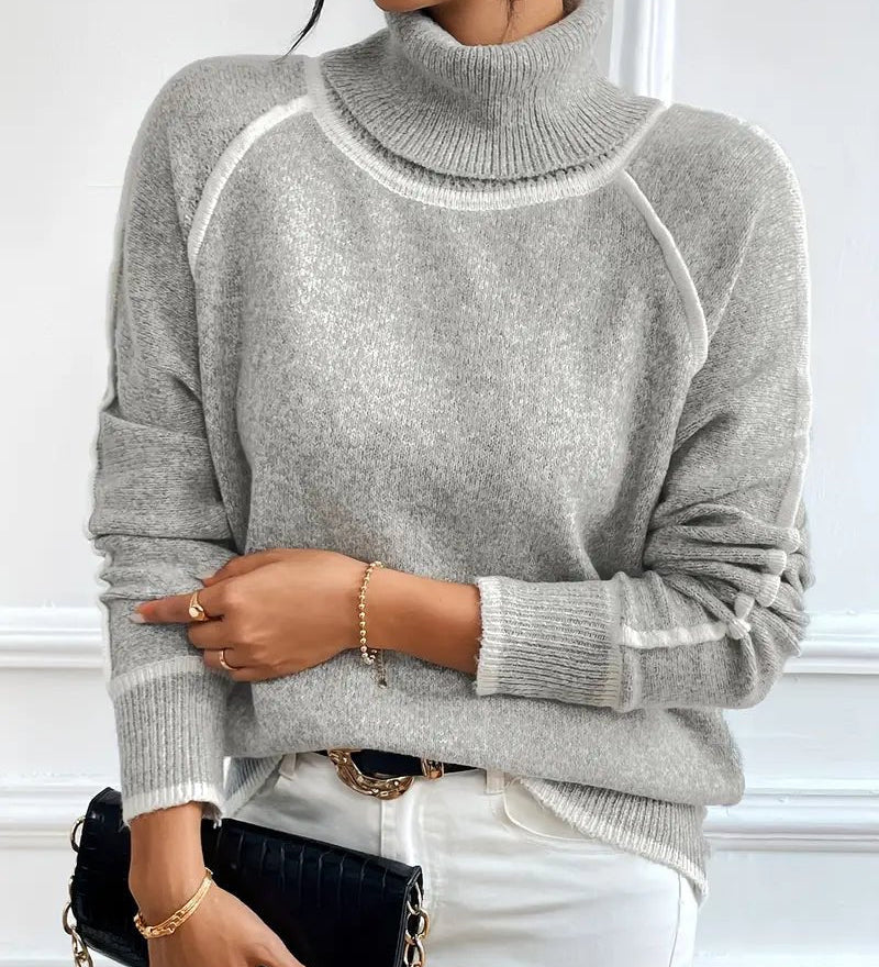 Striktrøje med høj hals og kontrastdetaljer