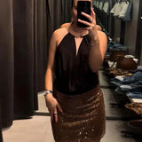 Halterneck bodystocking med dyb udskæring og elegant fald